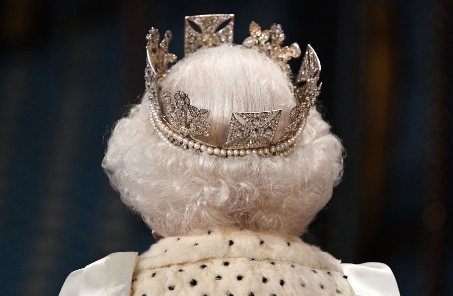 The back of the Queen's head; she wears a crown.