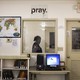 A security official walks past a prison library. 