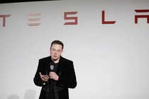 Elon Musk gives a presentation at Tesla