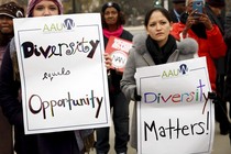 Demonstrators outside the Supreme Court hold signs advocating for diversity.