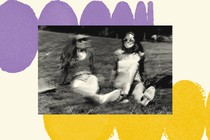 A black-and-white photograph is set on a cream-colored background. The background has rows of purple circles that look like they are curving away and rows of yellow circles that look like they are curving in the other direction. The photo shows two women in their 20s sitting on a grassy hill but the image is glitchy like the screen is malfunctioning, giving the sense of an error.