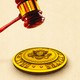 Illustration of a gavel on top of the presidential seal.