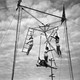 black and white photograph of circus women on rings