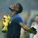 France's Paul Pogba holds the trophy as he celebrates winning the World Cup