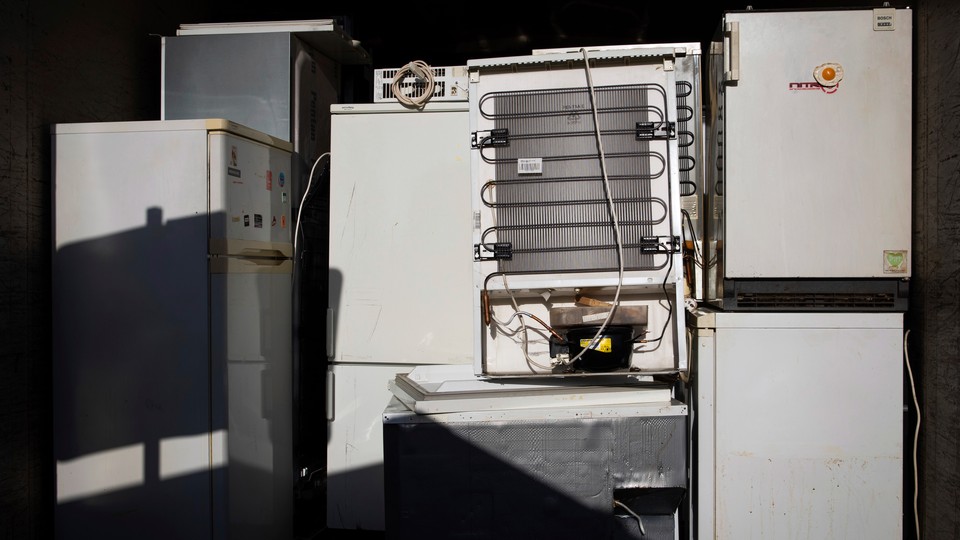 A collection of old refrigerators