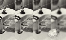 A splice of four black-and-white photos of hands being washed at a sink that increase in blurriness from left to right