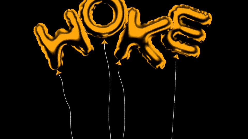 Gold letter-shaped balloons spelling out the word “woke”