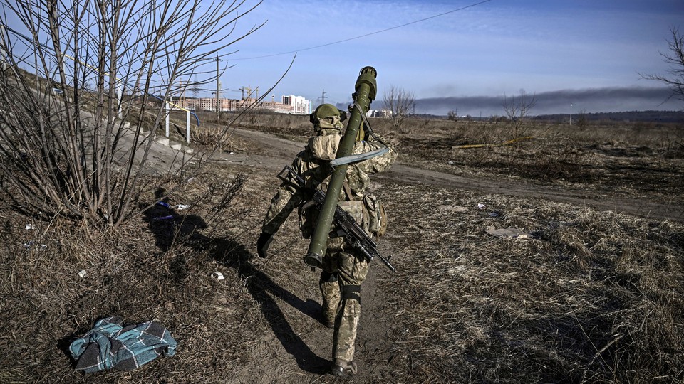 Ukrainian serviceman walking away from the camera