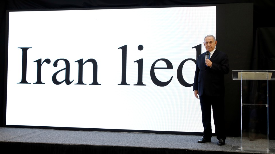 Prime Minister Netanyahu in front of a screen that reads "Iran lied"