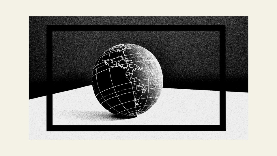 black-and-white photo of a globe surrounded by the outline of a black rectangle