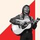John Denver playing the guitar