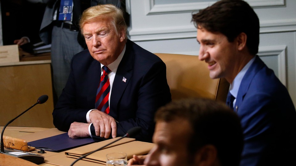 Trump at a working sessions at the G-7 summit in Canada