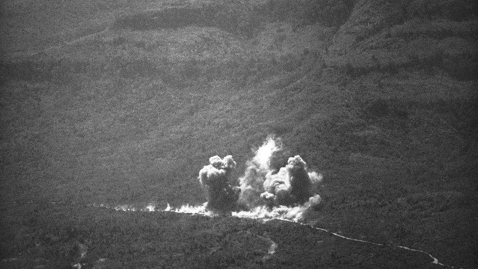 Smoke billows from bomb blasts along the Ho Chi Minh Trail in Laos on Feb. 11, 1971 as U.S. bombers pounded the area while supporting South Vietnamese.