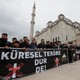 People take part in a demonstration against the Christchurch attack following Friday prayers in Istanbul, Turkey. The banners read "Say No to Global Terror!"