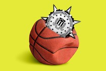 A spiky Department of Justice seal embedded in a deflating basketball