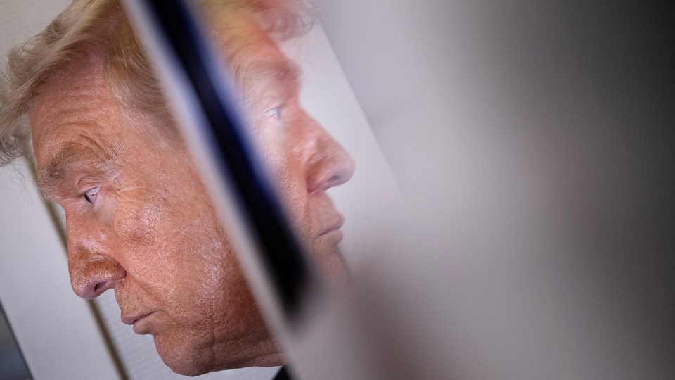 Photo of Donald Trump and his reflection