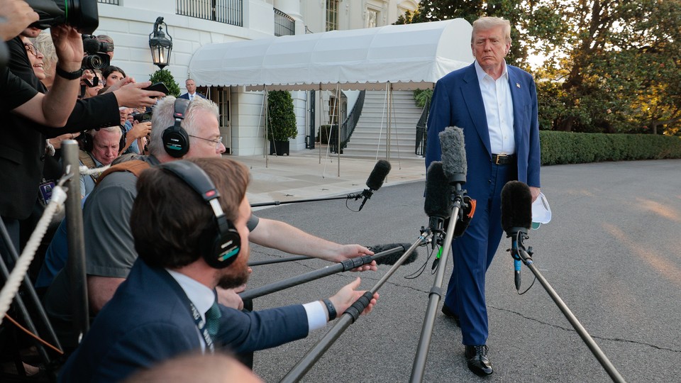 Picture of Trump looking annoyed at reporters