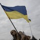Ukrainian flag waving in front of a cloudy sky