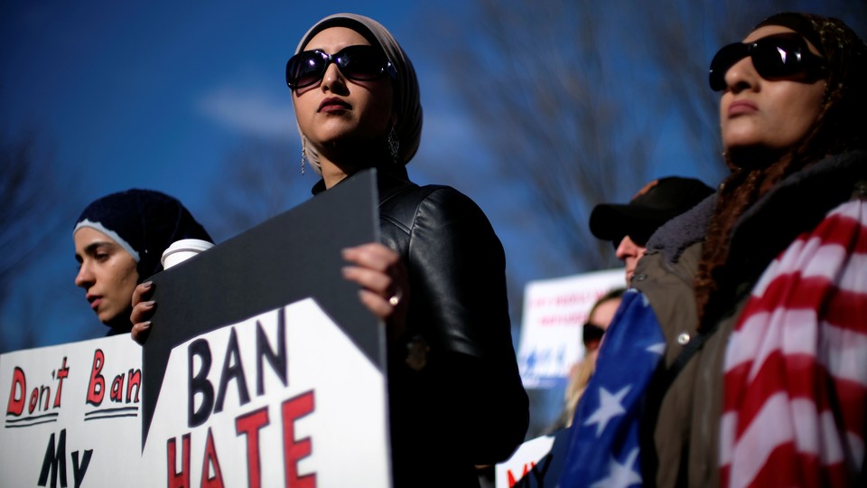 Activist groups such as the Council on American-Islamic Relations, MoveOn.org, Oxfam, and the ACLU hold a rally in front of the White House on January 27, 2018.