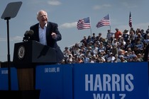 Tim Walz speaks at a campaign event in front of a crowd