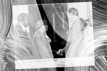 A photograph of a woman meeting President Jimmy Carter, with big wiping circles covering it.
