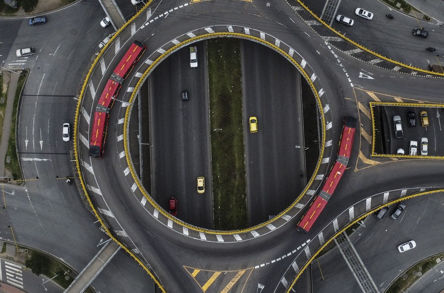 A complex, circular highway interchange captured from above