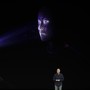 Phil Schiller stands in front of a screen demonstrating the Face ID feature of the iPhone X.