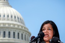 Rep. Pramila Jayapal speaking into microphones