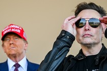 Photo of Elon Musk putting on sunglasses, with Donald Trump, wearing a MAGA hat, in the background