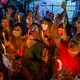 People march in a street in Yangon