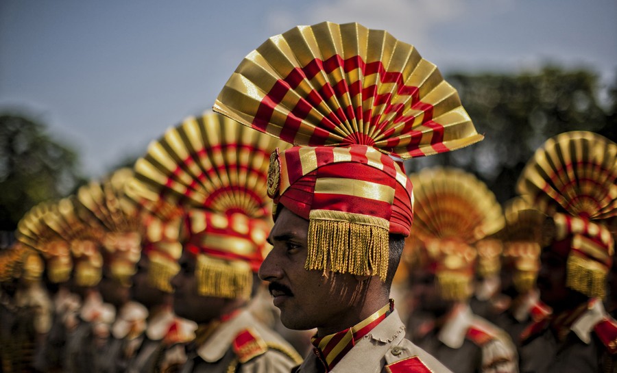 A contingent of Indian paramilitary troopers stands in formation before their parade at Bakshi Stadium