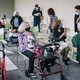 Seniors in masks wait for a coronavirus vaccine.