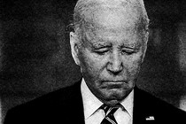 Grainy black-and-white photo of an older man in a suit looking sad.