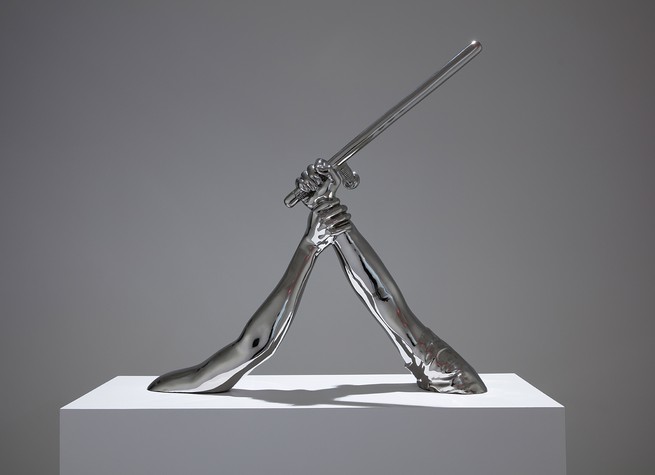 photo of 'Strike' (2018) by Hank Willis Thomas: a sculpture of one arm holding another arm with a baton 