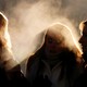 Three people gathered in the cold