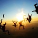 A group of skydivers pose as they fall through the air