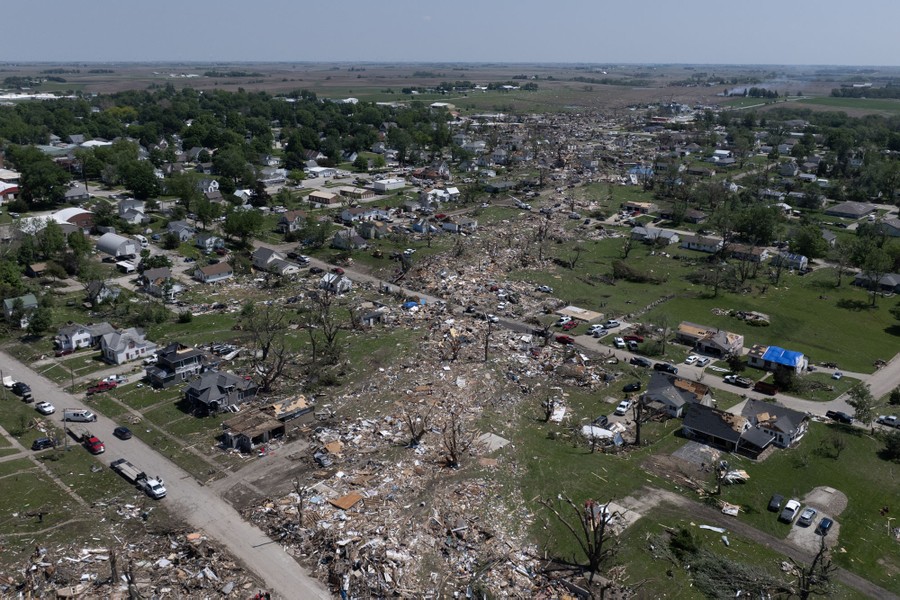 A visible path of destruction through a small town, left by a passing tornado