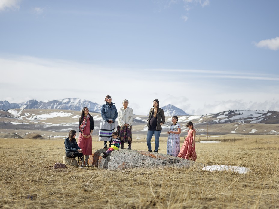 photo of four generations of Schildt woman at a sacred medicine rock on their property on the Blackfeet Reservation