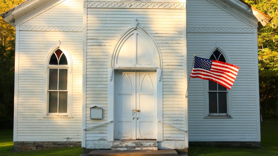 White church with an American flag