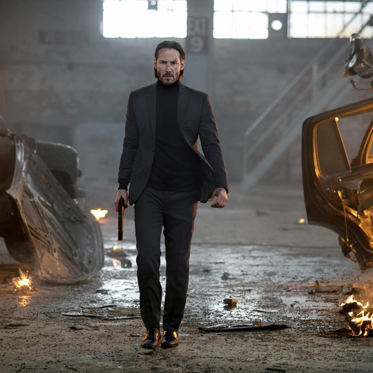 The movie John Wick 2. John wears a dirty white shirt. This is because all  his clothes and his washer were burned up when they blew up his house. His  dog is