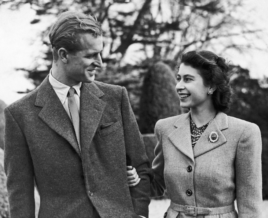 Princess Elizabeth and the Duke of Edinburgh pose, arm in arm.