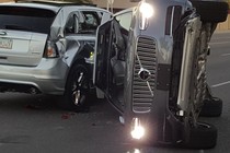 A self-driven Uber-owned Volvo flipped on its side after a collision in Tempe, Arizona. Police say Uber’s car did not cause the crash. 