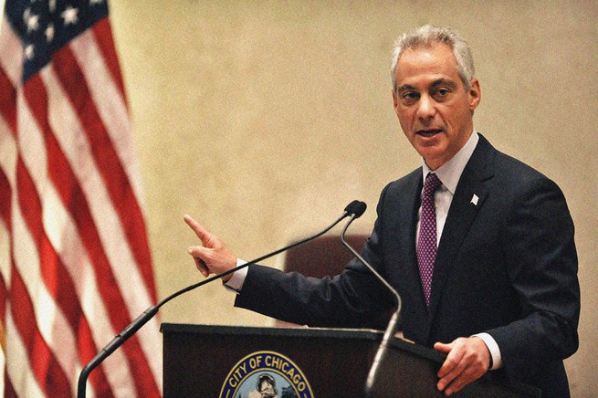 Rahm Emanuel standing at a podium speaking.