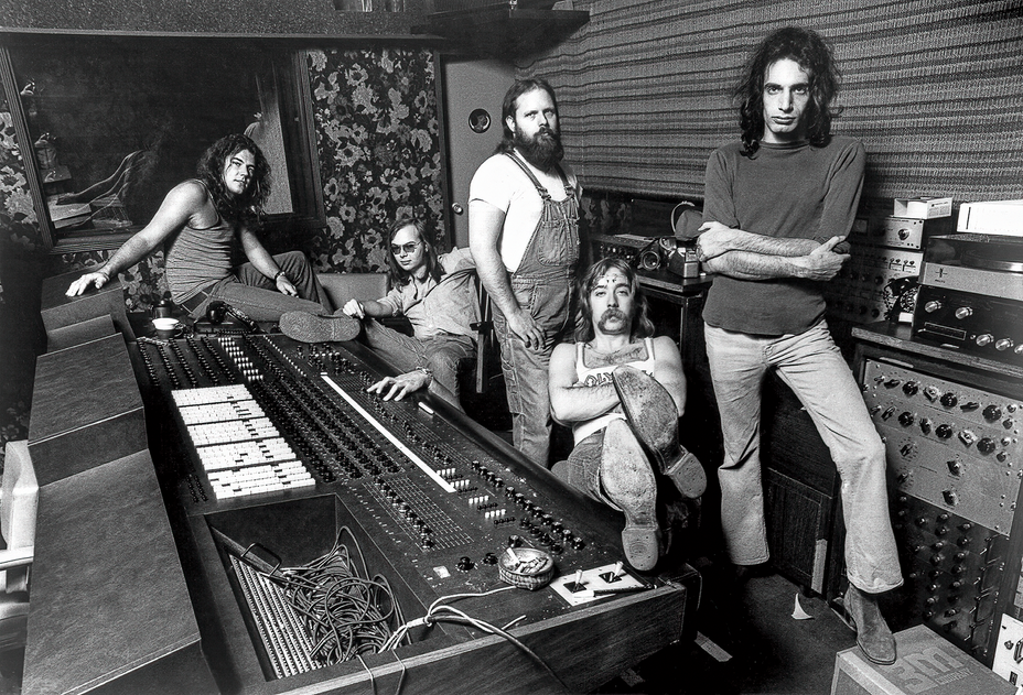 A photograph of the classic rock group Steely Dan inside the recording studio.