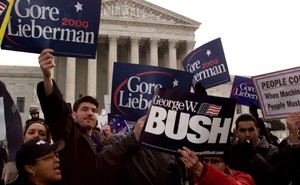 George W. Bush and Al Gore supporters hold signs outside the U.S. Supreme Court.