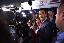 Photo of Vivek Ramaswamy surrounded by media in the debate spin room