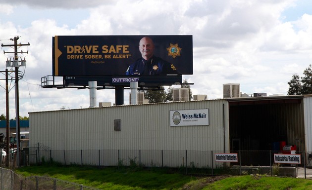 A picture of Police Chief Jerry Dyer on a billboard