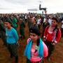 FARC fighters stand in a field