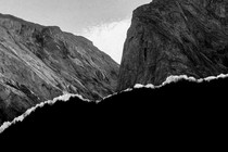 Black-and-white photograph of barren mountains