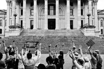 A black-and-white photograph of abortion-rights supporters protesting outside the Kansas statehouse in Topeka